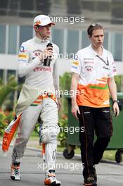 Paul di Resta (GBR) Sahara Force India F1 with Will Hings (GBR) Sahara Force India F1 Press Officer. 26.10.2013. Formula 1 World Championship, Rd 16, Indian Grand Prix, New Delhi, India, Qualifying Day.