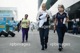 Valtteri Bottas (FIN) Williams with Sophie Eden (GBR) Williams Press Officer. 26.10.2013. Formula 1 World Championship, Rd 16, Indian Grand Prix, New Delhi, India, Qualifying Day.
