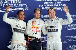 Qualifying top three in parc ferme (L to R): Nico Rosberg (GER) Mercedes AMG F1, second; Sebastian Vettel (GER) Red Bull Racing, pole position; Lewis Hamilton (GBR) Mercedes AMG F1, third. 26.10.2013. Formula 1 World Championship, Rd 16, Indian Grand Prix, New Delhi, India, Qualifying Day.