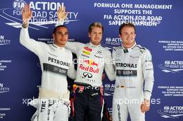 Qualifying top three in parc ferme (L to R): Nico Rosberg (GER) Mercedes AMG F1, second; Sebastian Vettel (GER) Red Bull Racing, pole position; Lewis Hamilton (GBR) Mercedes AMG F1, third. 26.10.2013. Formula 1 World Championship, Rd 16, Indian Grand Prix, New Delhi, India, Qualifying Day.