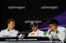 The FIA Press Conference (L to R): Nico Rosberg (GER) Mercedes AMG F1; Sebastian Vettel (GER) Red Bull Racing; Lewis Hamilton (GBR) Mercedes AMG F1. 26.10.2013. Formula 1 World Championship, Rd 16, Indian Grand Prix, New Delhi, India, Qualifying Day.