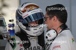 (L to R): Adrian Sutil (GER) Sahara Force India F1 with Bradley Joyce (GBR) Sahara Force India F1 Race Engineer. 26.10.2013. Formula 1 World Championship, Rd 16, Indian Grand Prix, New Delhi, India, Qualifying Day.