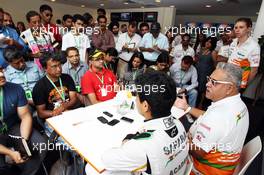  Dr. Vijay Mallya (IND) Sahara Force India F1 Team Owner and Jehan Daruvala (IND) Sahara Force India Academy Driver, winner of the British KF3 Karting Championship, with the media. 26.10.2013. Formula 1 World Championship, Rd 16, Indian Grand Prix, New Delhi, India, Qualifying Day.