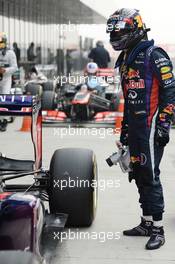 Pole sitter Sebastian Vettel (GER) Red Bull Racing cools the brakes on his Red Bull Racing RB9 in parc ferme. 26.10.2013. Formula 1 World Championship, Rd 16, Indian Grand Prix, New Delhi, India, Qualifying Day.