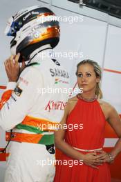 Jennifer Becks (GER) with boyfriend Adrian Sutil (GER) Sahara Force India F1. 26.10.2013. Formula 1 World Championship, Rd 16, Indian Grand Prix, New Delhi, India, Qualifying Day.