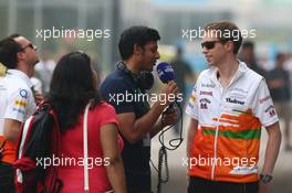Will Hings (GBR) Sahara Force India F1 Press Officer with the media. 26.10.2013. Formula 1 World Championship, Rd 16, Indian Grand Prix, New Delhi, India, Qualifying Day.