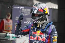 Sebastian Vettel (GER) Red Bull Racing celebrates his pole position in parc ferme. 26.10.2013. Formula 1 World Championship, Rd 16, Indian Grand Prix, New Delhi, India, Qualifying Day.