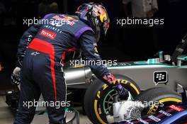 Pole sitter Sebastian Vettel (GER) Red Bull Racing uses a fan to cool the brakes on his Red Bull Racing RB9. 26.10.2013. Formula 1 World Championship, Rd 16, Indian Grand Prix, New Delhi, India, Qualifying Day.