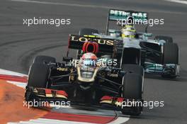 Romain Grosjean (FRA) Lotus F1 E21 leads Nico Rosberg (GER) Mercedes AMG F1 W04. 26.10.2013. Formula 1 World Championship, Rd 16, Indian Grand Prix, New Delhi, India, Qualifying Day.