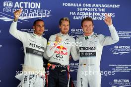Qualifying top three in parc ferme (L to R): Nico Rosberg (GER) Mercedes AMG F1, second; Sebastian Vettel (GER) Red Bull Racing, pole position; Lewis Hamilton (GBR) Mercedes AMG F1, third. 26.10.2013. Formula 1 World Championship, Rd 16, Indian Grand Prix, New Delhi, India, Qualifying Day.