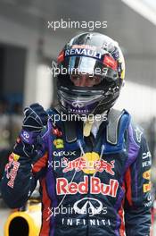 Sebastian Vettel (GER) Red Bull Racing celebrates his pole position in parc ferme. 26.10.2013. Formula 1 World Championship, Rd 16, Indian Grand Prix, New Delhi, India, Qualifying Day.
