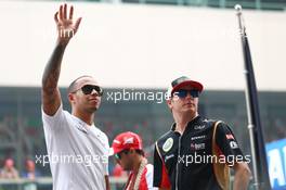 (L to R): Lewis Hamilton (GBR) Mercedes AMG F1 and Kimi Raikkonen (FIN) Lotus F1 Team on the drivers parade. 27.10.2013. Formula 1 World Championship, Rd 16, Indian Grand Prix, New Delhi, India, Race Day.