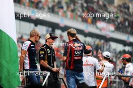 (L to R): Valtteri Bottas (FIN) Williams, Kimi Raikkonen (FIN) Lotus F1 Team and Sebastian Vettel (GER) Red Bull Racing on the drivers parade. 27.10.2013. Formula 1 World Championship, Rd 16, Indian Grand Prix, New Delhi, India, Race Day.