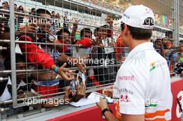 Adrian Sutil (GER) Sahara Force India F1 signs autographs for the fans. 24.10.2013. Formula 1 World Championship, Rd 16, Indian Grand Prix, New Delhi, India, Preparation Day.
