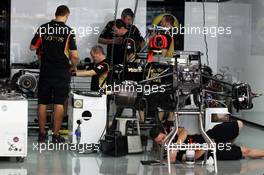 Lotus F1 E21 is prepared by mechanics in the pits. 24.10.2013. Formula 1 World Championship, Rd 16, Indian Grand Prix, New Delhi, India, Preparation Day.