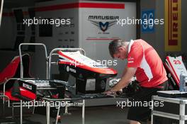 Marussia F1 Team MR02 front wing prepared in the pits by a mechanic. 24.10.2013. Formula 1 World Championship, Rd 16, Indian Grand Prix, New Delhi, India, Preparation Day.