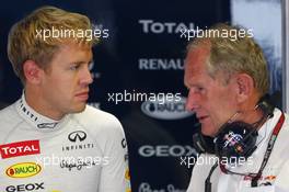 (L to R): Sebastian Vettel (GER) Red Bull Racing with Dr Helmut Marko (AUT) Red Bull Motorsport Consultant. 06.09.2013. Formula 1 World Championship, Rd 12, Italian Grand Prix, Monza, Italy, Practice Day.