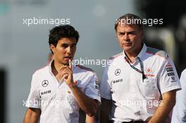 (L to R): Sergio Perez (MEX) McLaren with Dave Redding (GBR) McLaren Sporting Director. 06.09.2013. Formula 1 World Championship, Rd 12, Italian Grand Prix, Monza, Italy, Practice Day.