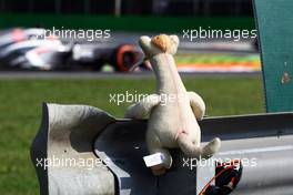 A smoking soft toy watches Nico Hulkenberg (GER) Sauber C32. 06.09.2013. Formula 1 World Championship, Rd 12, Italian Grand Prix, Monza, Italy, Practice Day.