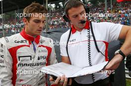 (L to R): Jules Bianchi (FRA) Marussia F1 Team with Paul Davison (GBR) Marussia F1 Team Race Engineer on the grid. 08.09.2013. Formula 1 World Championship, Rd 12, Italian Grand Prix, Monza, Italy, Race Day.