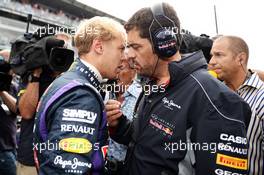 Sebastian Vettel (GER) Red Bull Racing with Guillaume Rocquelin (ITA) Red Bull Racing Race Engineer on the grid. 08.09.2013. Formula 1 World Championship, Rd 12, Italian Grand Prix, Monza, Italy, Race Day.