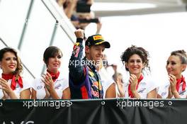 Race winner Sebastian Vettel (GER) Red Bull Racing celebrates on the podium. 08.09.2013. Formula 1 World Championship, Rd 12, Italian Grand Prix, Monza, Italy, Race Day.