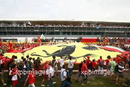 Ferrari fans under the podium. 08.09.2013. Formula 1 World Championship, Rd 12, Italian Grand Prix, Monza, Italy, Race Day.