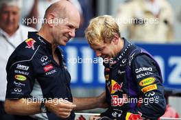 (L to R): Adrian Newey (GBR) Red Bull Racing Chief Technical Officer celebrates with race winner Sebastian Vettel (GER) Red Bull Racing in parc ferme. 08.09.2013. Formula 1 World Championship, Rd 12, Italian Grand Prix, Monza, Italy, Race Day.