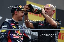 1st place Sebastian Vettel (GER) Red Bull Racing with Adrian Newey (GBR) Red Bull Racing Chief Technical Officer. 08.09.2013. Formula 1 World Championship, Rd 12, Italian Grand Prix, Monza, Italy, Race Day.