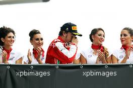 Second placed Fernando Alonso (ESP) Ferrari heads to the podium. 08.09.2013. Formula 1 World Championship, Rd 12, Italian Grand Prix, Monza, Italy, Race Day.