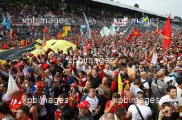 Fans celebrate under the podium. 08.09.2013. Formula 1 World Championship, Rd 12, Italian Grand Prix, Monza, Italy, Race Day.