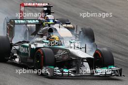 Lewis Hamilton (GBR) Mercedes AMG F1 W04 and Jean-Eric Vergne (FRA) Scuderia Toro Rosso STR8 battle for position. 08.09.2013. Formula 1 World Championship, Rd 12, Italian Grand Prix, Monza, Italy, Race Day.