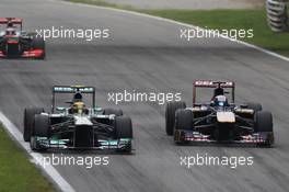 Lewis Hamilton (GBR) Mercedes AMG F1 W04 and Jean-Eric Vergne (FRA) Scuderia Toro Rosso STR8 battle for position. 08.09.2013. Formula 1 World Championship, Rd 12, Italian Grand Prix, Monza, Italy, Race Day.