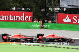 Max Chilton (GBR) Marussia F1 Team MR02 and team mate Jules Bianchi (FRA) Marussia F1 Team MR02 battle for position. 08.09.2013. Formula 1 World Championship, Rd 12, Italian Grand Prix, Monza, Italy, Race Day.