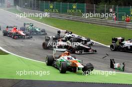 Paul di Resta (GBR) Sahara Force India VJM06 crashes at the start of the race. 08.09.2013. Formula 1 World Championship, Rd 12, Italian Grand Prix, Monza, Italy, Race Day.