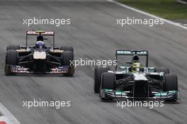 Nico Rosberg (GER) Mercedes AMG F1 W04 leads Daniel Ricciardo (AUS) Scuderia Toro Rosso STR8. 08.09.2013. Formula 1 World Championship, Rd 12, Italian Grand Prix, Monza, Italy, Race Day.