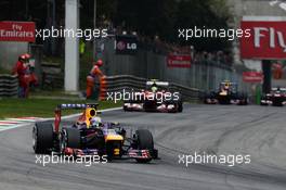 Sebastian Vettel (GER) Red Bull Racing RB9 leads the race. 08.09.2013. Formula 1 World Championship, Rd 12, Italian Grand Prix, Monza, Italy, Race Day.