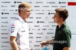 (L to R): Kevin Magnussen (DEN) McLaren Test Driver with Will Stevens (GBR) Caterham F1 Team Test Driver. 07.09.2013. Formula 1 World Championship, Rd 12, Italian Grand Prix, Monza, Italy, Qualifying Day.