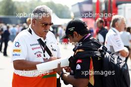 Dr. Vijay Mallya (IND) Sahara Force India F1 Team Owner signs autographs for the fans. 07.09.2013. Formula 1 World Championship, Rd 12, Italian Grand Prix, Monza, Italy, Qualifying Day.