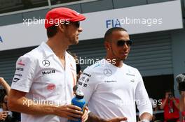 (L to R): Jenson Button (GBR) McLaren and Lewis Hamilton (GBR) Mercedes AMG F1 on the drivers parade. 08.09.2013. Formula 1 World Championship, Rd 12, Italian Grand Prix, Monza, Italy, Race Day.