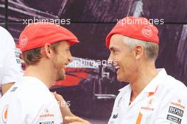 (L to R): Jenson Button (GBR) McLaren and Martin Whitmarsh (GBR) McLaren Chief Executive Officer celebrate 50 years of McLaren as a constructor. 08.09.2013. Formula 1 World Championship, Rd 12, Italian Grand Prix, Monza, Italy, Race Day.