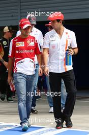 (L to R): Felipe Massa (BRA) Ferrari and Sergio Perez (MEX) McLaren on the drivers parade. 08.09.2013. Formula 1 World Championship, Rd 12, Italian Grand Prix, Monza, Italy, Race Day.