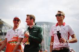 (L to R): Adrian Sutil (GER) Sahara Force India F1, Giedo van der Garde (NLD) Caterham F1 Team and Max Chilton (GBR) Marussia F1 Team on the drivers parade. 08.09.2013. Formula 1 World Championship, Rd 12, Italian Grand Prix, Monza, Italy, Race Day.