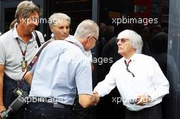 Bernie Ecclestone (GBR) CEO Formula One Group (FOM) with Jad Sherif (SUI) Photographer. 08.09.2013. Formula 1 World Championship, Rd 12, Italian Grand Prix, Monza, Italy, Race Day.
