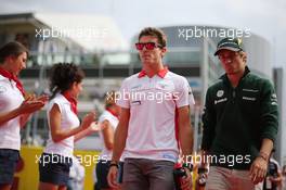(L to R): Jules Bianchi (FRA) Marussia F1 Team and Charles Pic (FRA) Caterham on the drivers parade. 08.09.2013. Formula 1 World Championship, Rd 12, Italian Grand Prix, Monza, Italy, Race Day.