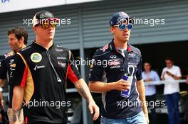 (L to R): Kimi Raikkonen (FIN) Lotus F1 Team and Sebastian Vettel (GER) Red Bull Racing on the drivers parade. 08.09.2013. Formula 1 World Championship, Rd 12, Italian Grand Prix, Monza, Italy, Race Day.