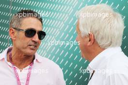 (L to R): Mick Doohan (AUS) Former 500c Motorbike World Champion with Charlie Whiting (GBR) FIA Delegate. 08.09.2013. Formula 1 World Championship, Rd 12, Italian Grand Prix, Monza, Italy, Race Day.