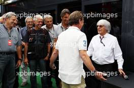 Bernie Ecclestone (GBR) CEO Formula One Group (FOM) with Crispin Thruston (GBR) Phototgrapher. 08.09.2013. Formula 1 World Championship, Rd 12, Italian Grand Prix, Monza, Italy, Race Day.