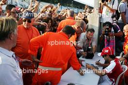 Felipe Massa (BRA) Ferrari signs autographs for the fans. 05.09.2013. Formula 1 World Championship, Rd 12, Italian Grand Prix, Monza, Italy, Preparation Day.