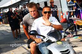 Lewis Hamilton (GBR) Mercedes AMG F1 on a moped in the pits. 05.09.2013. Formula 1 World Championship, Rd 12, Italian Grand Prix, Monza, Italy, Preparation Day.